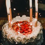 Lighted Candles on an Elegant Looking Cake