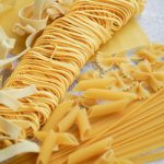 yellow pasta on white paper