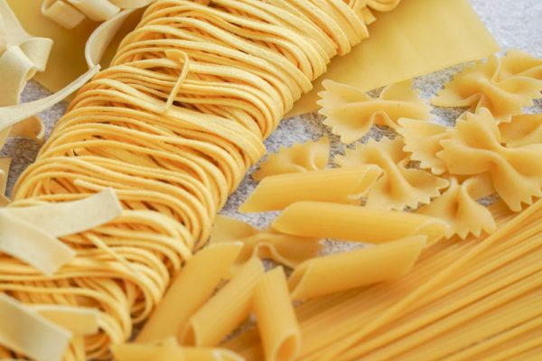 yellow pasta on white paper