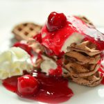 waffles, chocolate wafers, cherry sauce