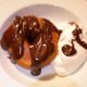 apple fritters, chocolate sauce, cream